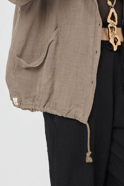 Dune Pamuk Hoodie in brown with textured fabric, featuring a hood and pockets, perfect for summer wear.