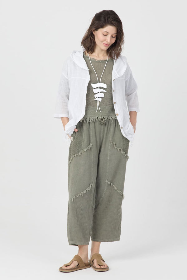 Sage Echo Pantolon in sage green, featuring raw hem details, paired with a white lightweight jacket and boho accessories.