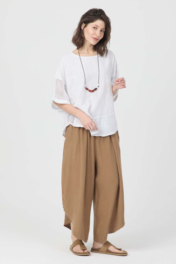 Model wearing Snow File Kol Bluz with file details, paired with harem pants for a casual summer look.